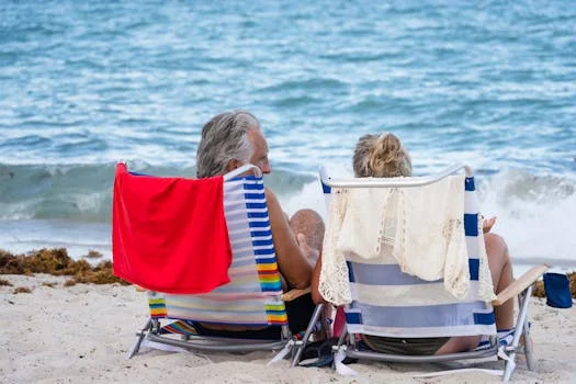 Person relaxing on a beach representing financial independence and early retirement