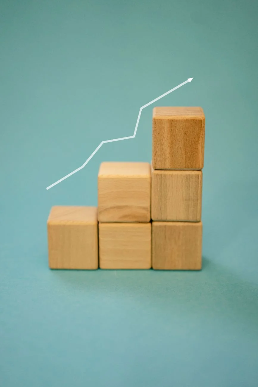 A green upward trending growth chart on a desk