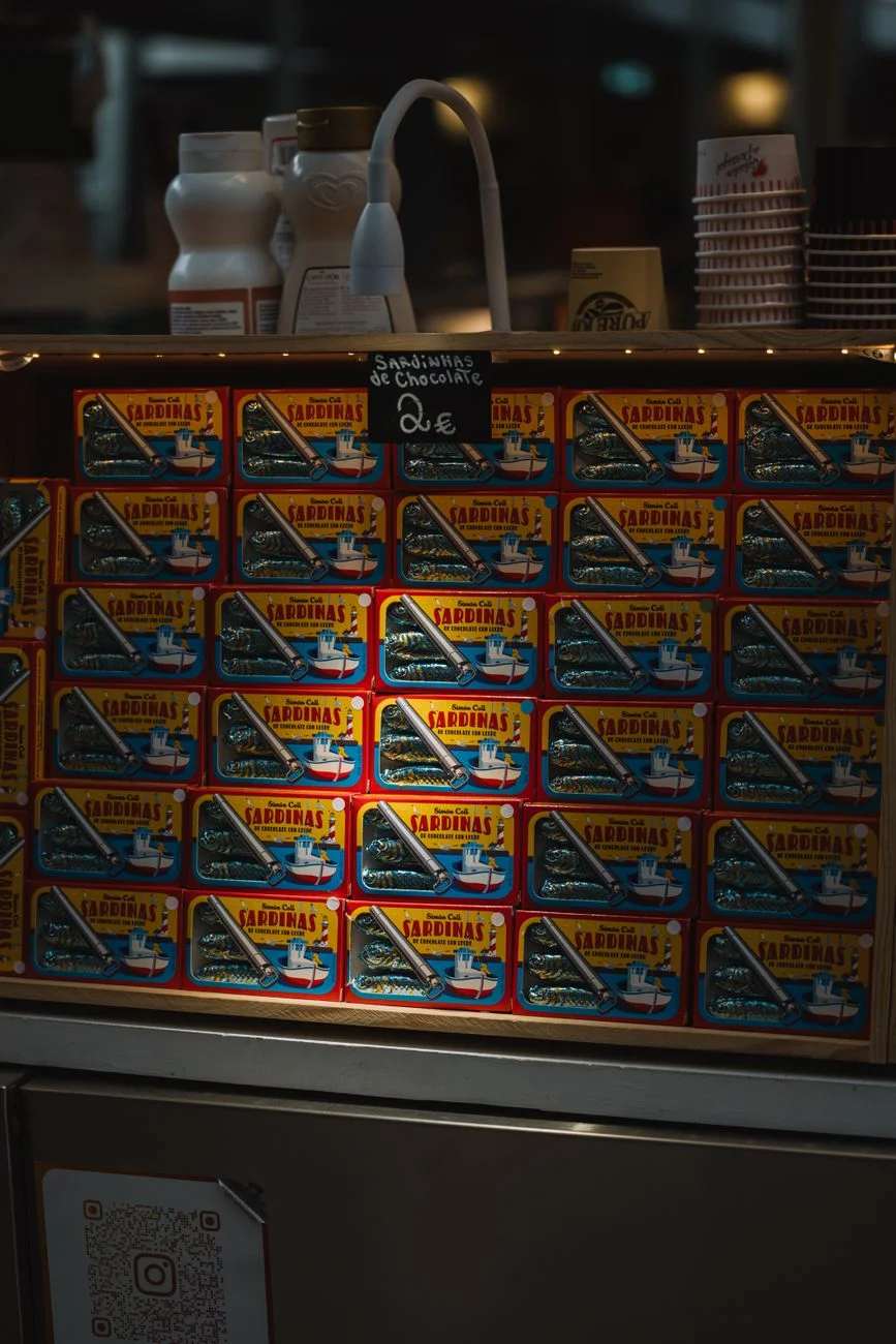 Rows of price tags on a store shelf, representing choosing between pricing tiers