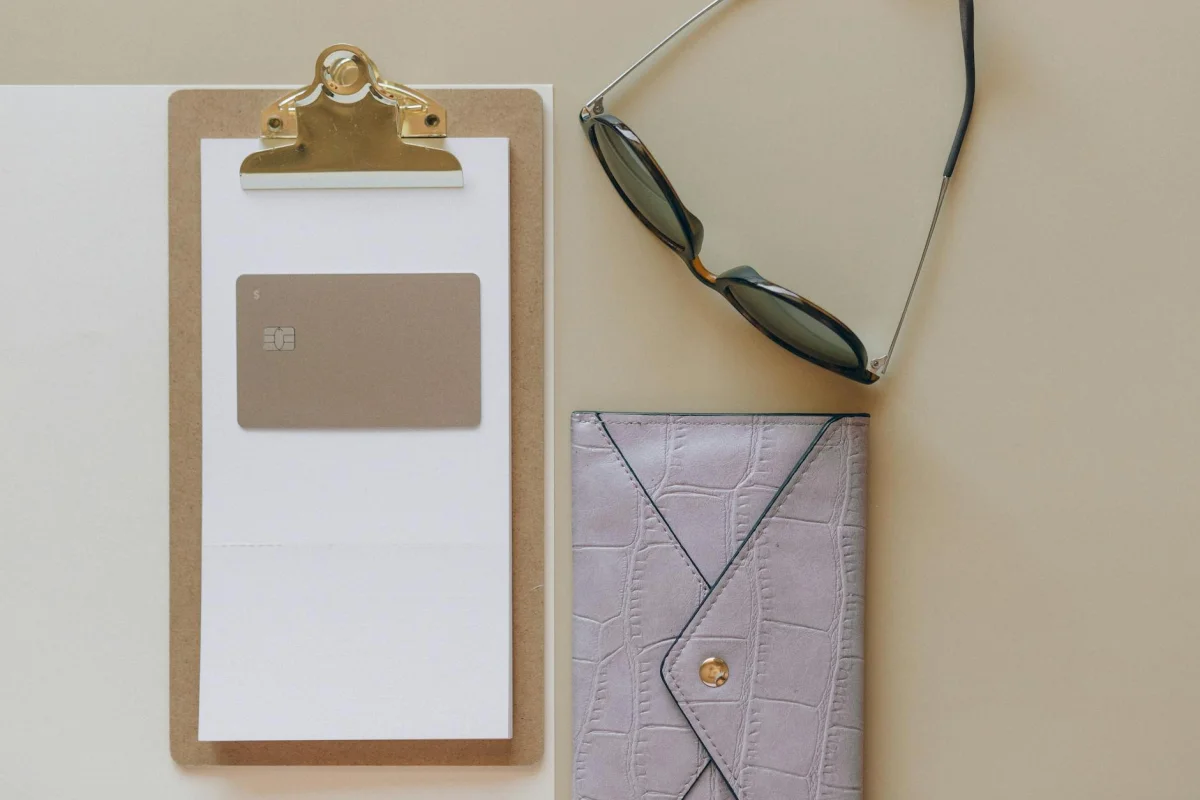 Credit card and wallet on a table representing personal debt management