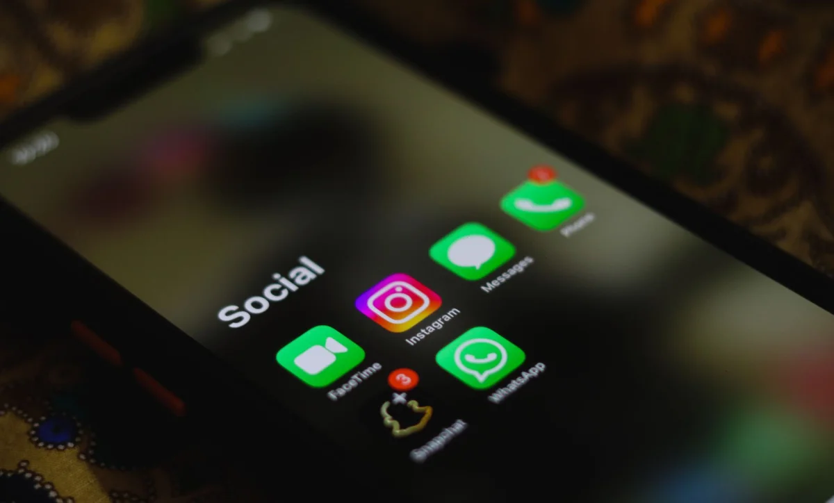 A smartphone screen showing social media analytics and engagement numbers