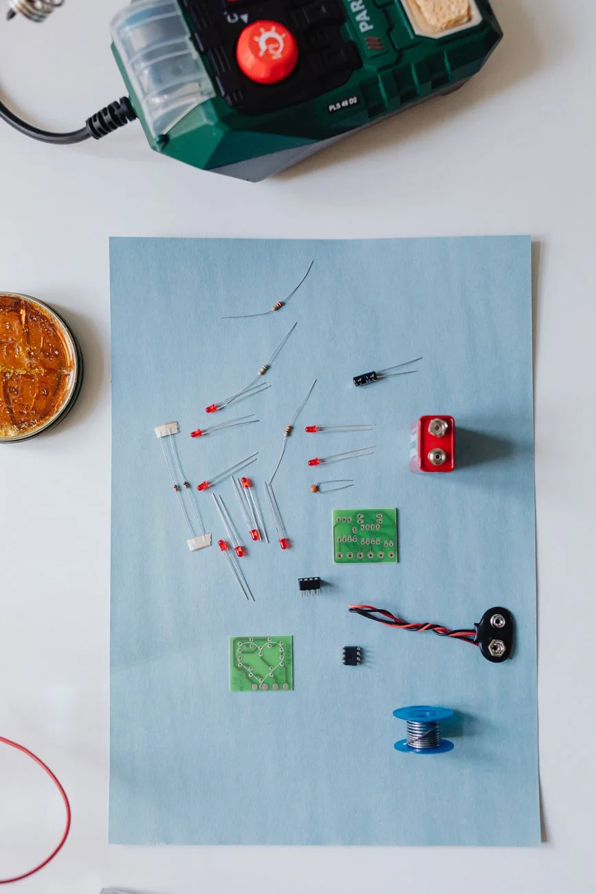 A small electronics breadboard with colored resistors and LEDs wired into a test circuit