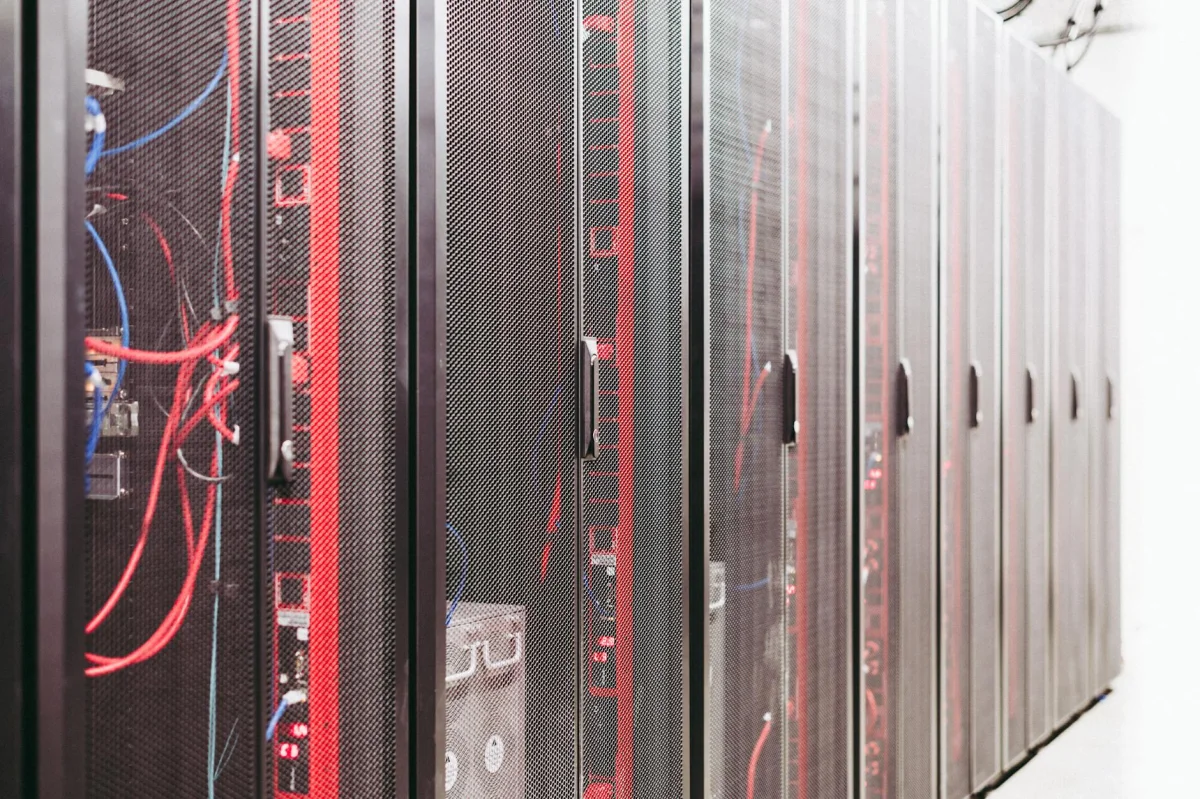 Server room with rows of network racks and equipment