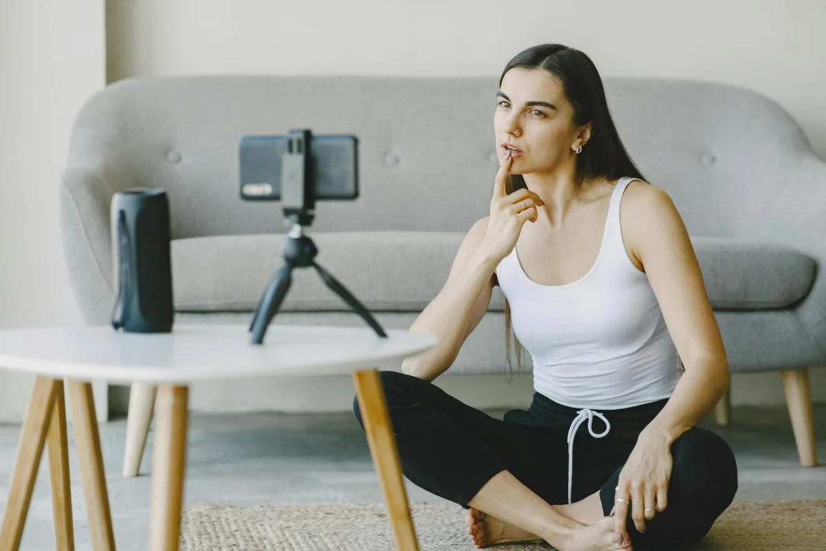 Content creator filming with camera and ring light for a brand campaign