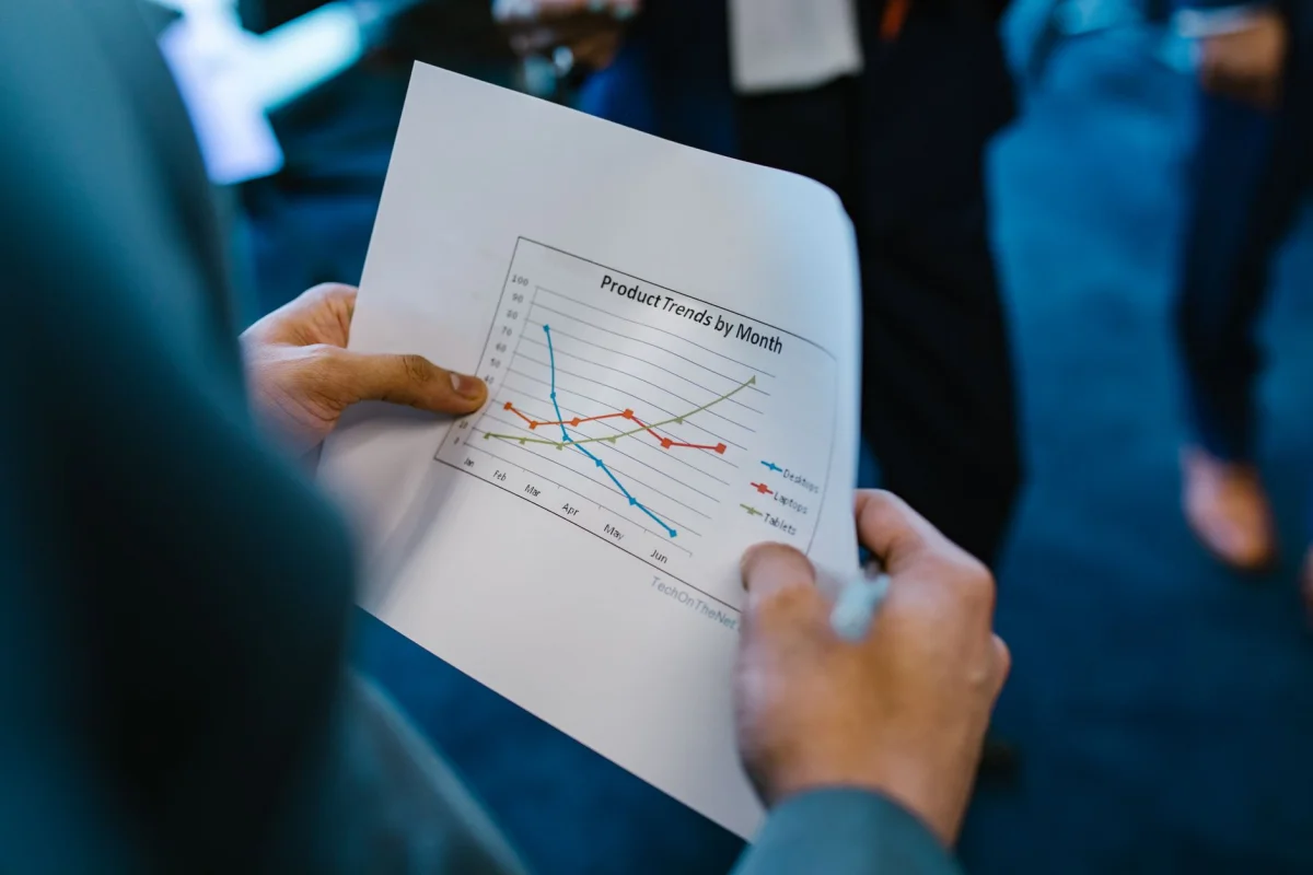 A hand-drawn line chart on paper showing an upward growth trend across several points