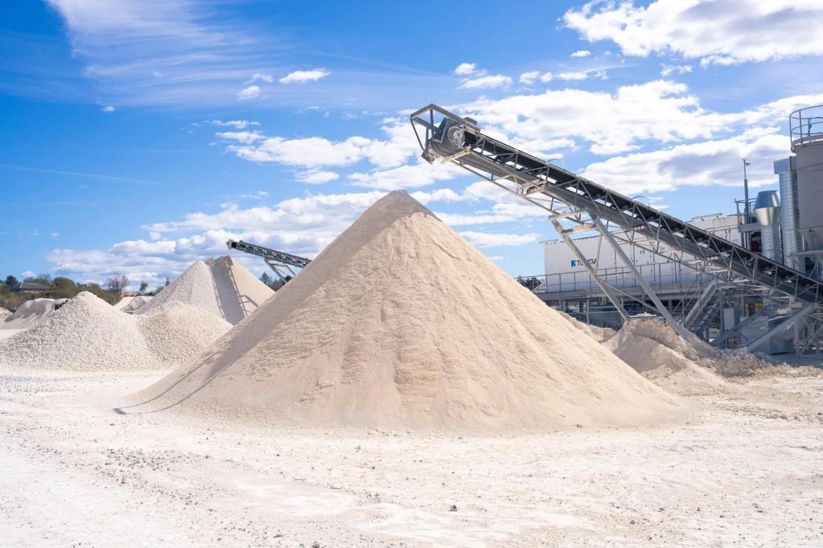 A large pile of crushed gravel at a stone yard