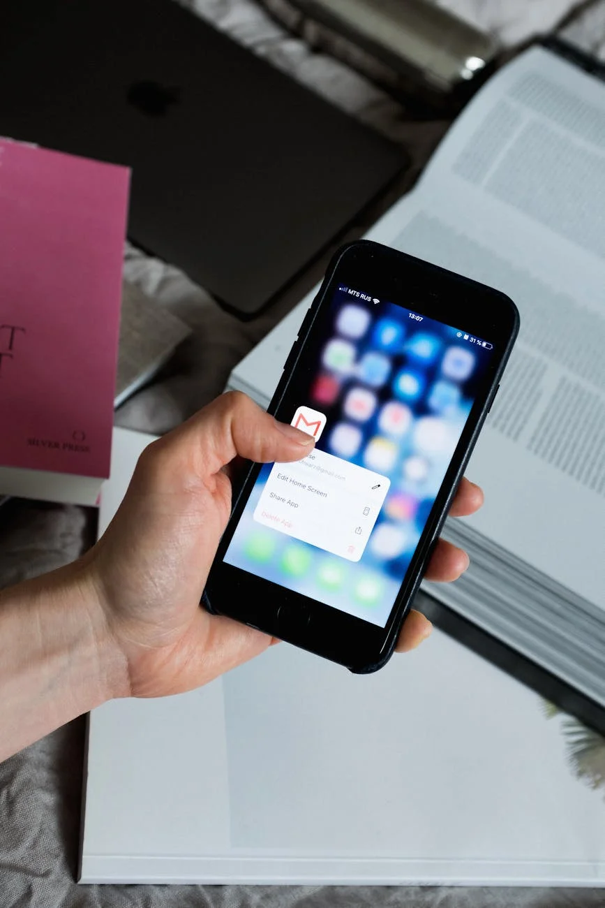 Smartphone showing email inbox with notifications