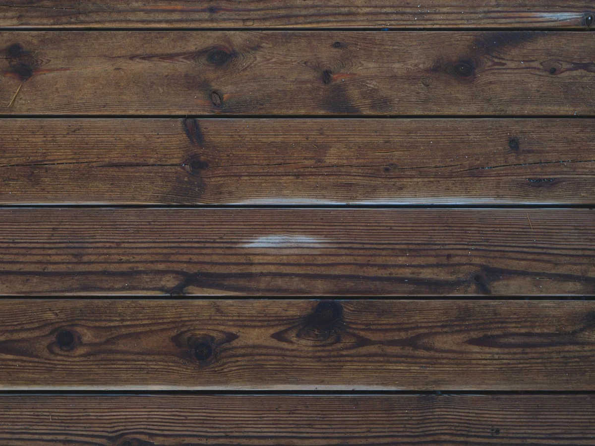 Stack of hardwood flooring planks laid out during a room installation