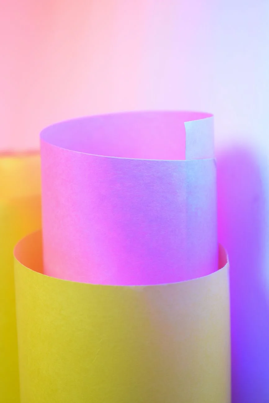 Close-up of a wallpaper roll unrolled showing a repeating pattern