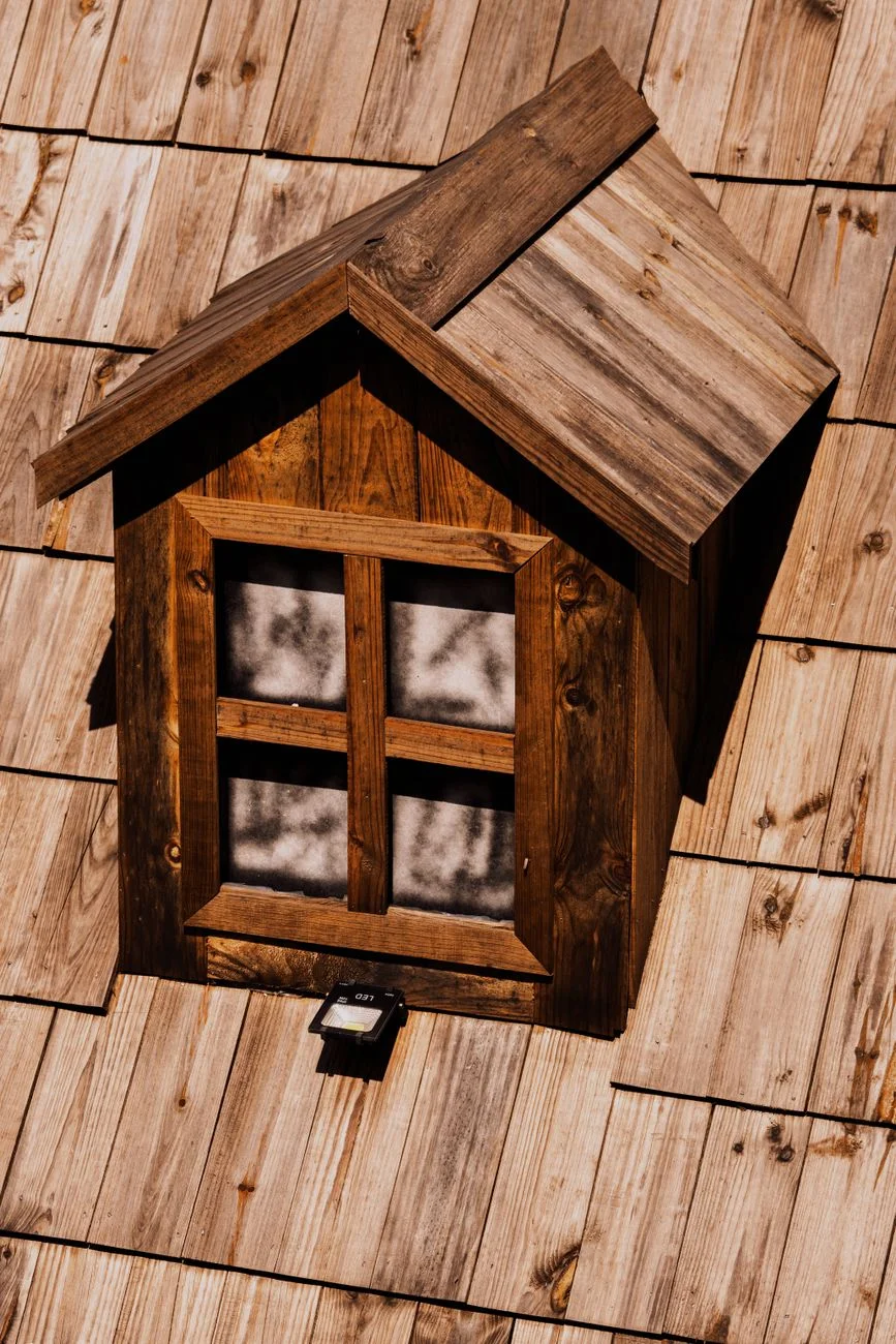 Close-up of overlapping asphalt shingles on a residential roof