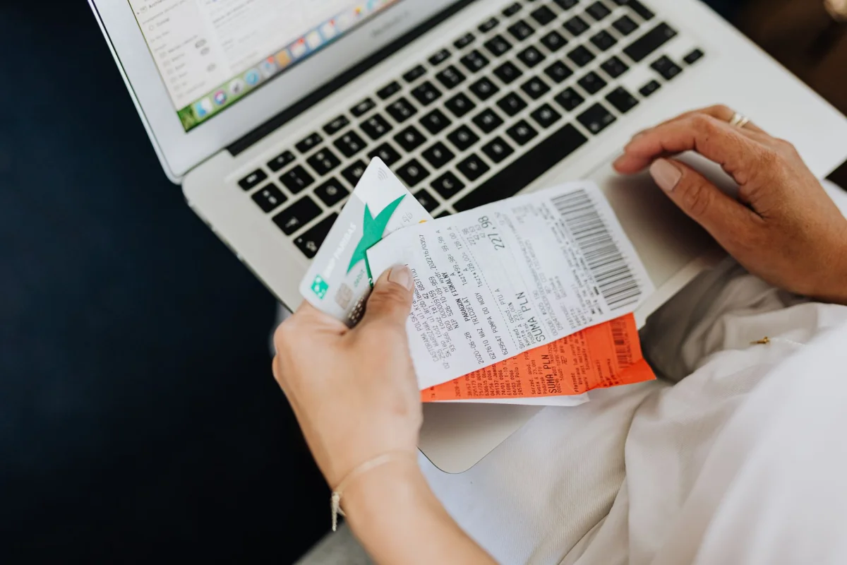 A credit card next to printed receipts representing recurring subscription charges